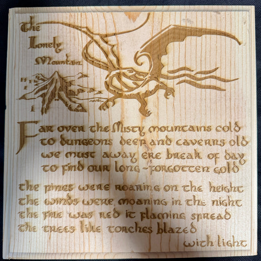 Wooden plaque with engraved text and dragon design